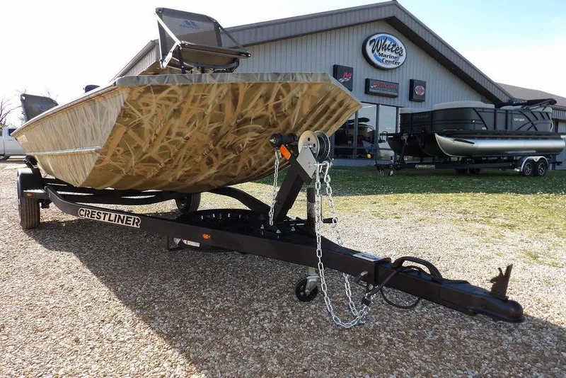 Slide: The Image of 2026 Crestliner 1860 Retriever Deluxe boat on trailer at marine center. - 30