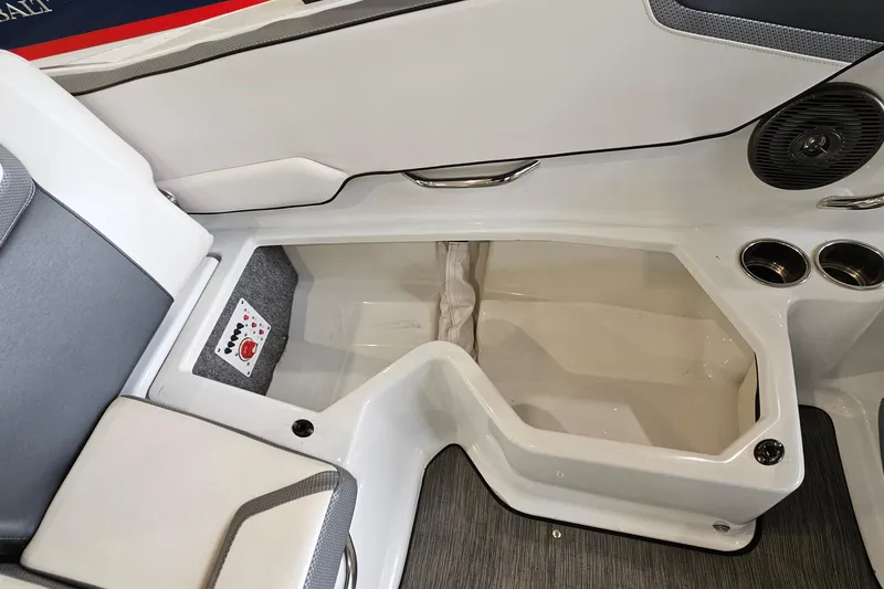 Slide: The Image of Interior view of a 2021 Scarab 195 ID boat, featuring seating and storage compartments. - 22
