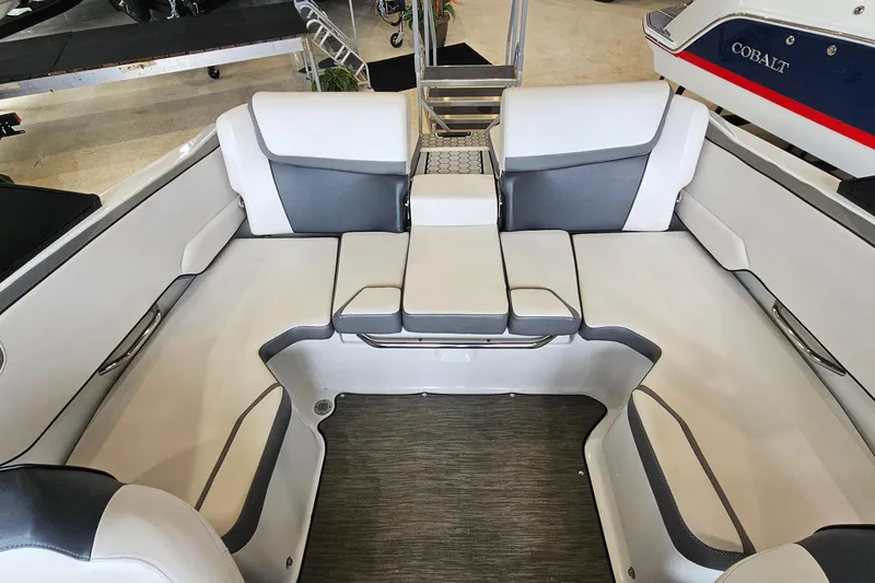 Slide: The Image of 2021 Scarab 195 ID boat interior with white and gray seating arrangement. - 8