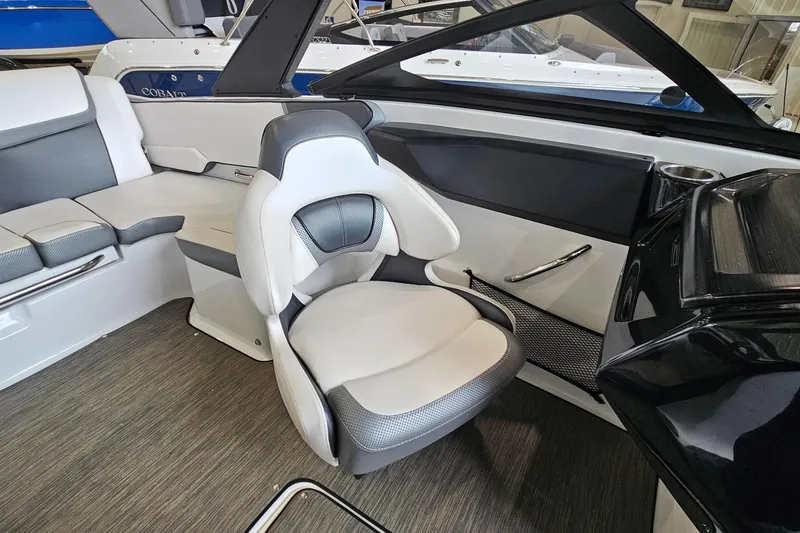 Slide: The Image of Interior of a 2021 Scarab 195 ID boat featuring modern seating and sleek design. - 9