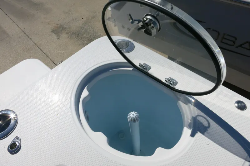 Slide: The Image of Livewell on 2026 Robalo R270 Center Console boat, open lid, white textured surface. - 13