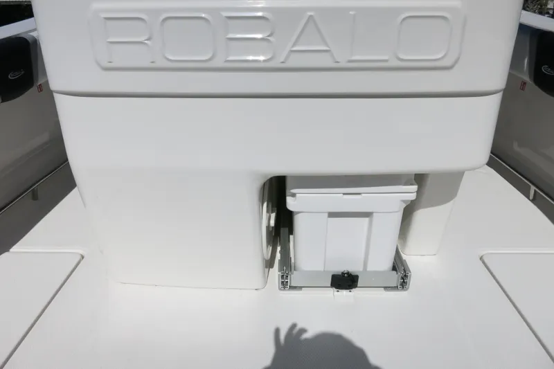 Slide: The Image of 2026 Robalo R270 Center Console boat storage compartment with integrated cooler. - 14