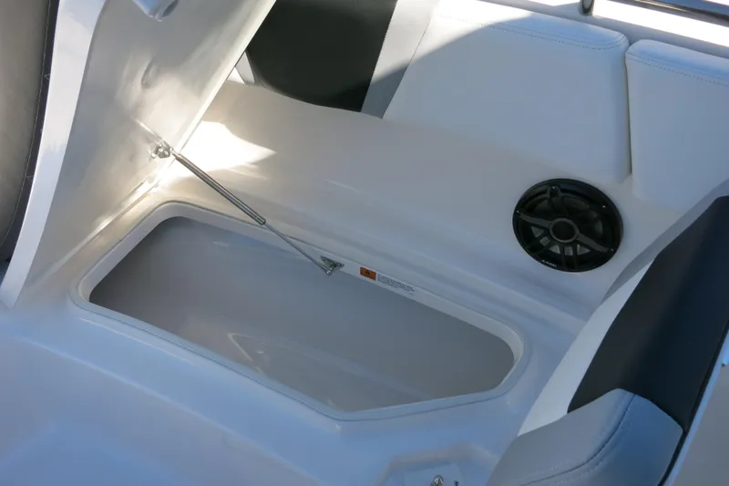 Slide: The Image of 2026 Robalo R270 Center Console storage compartment with speaker detail. - 20
