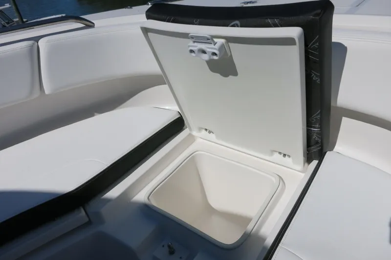 Slide: The Image of 2026 Robalo R270 Center Console boat with open storage compartment. - 22