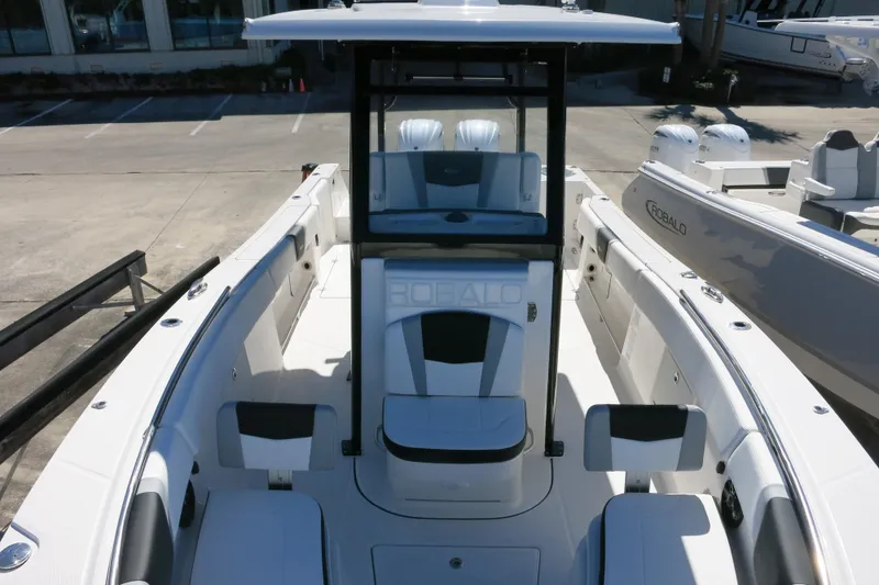 Slide: The Image of 2026 Robalo R270 Center Console boat with sleek design and spacious seating. - 23