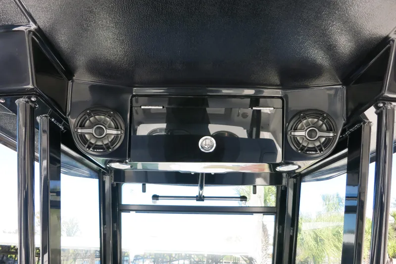 Slide: The Image of 2026 Robalo R270 Center Console boat interior with speakers and sleek design. - 28