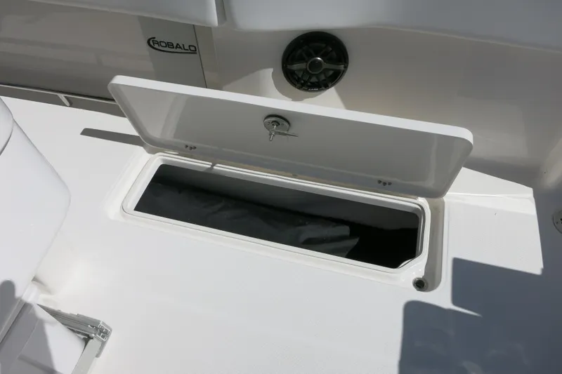 Slide: The Image of 2026 Robalo R270 Center Console boat storage compartment open on deck. - 29