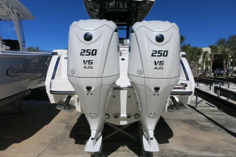 Slide: The Image of 2026 Robalo R270 Center Console with twin 250 V6 4.2L engines, rear view. - 4