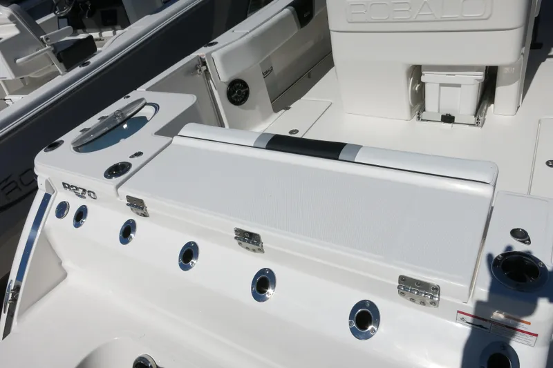 Slide: The Image of 2026 Robalo R270 Center Console boat interior with seating and storage features. - 8