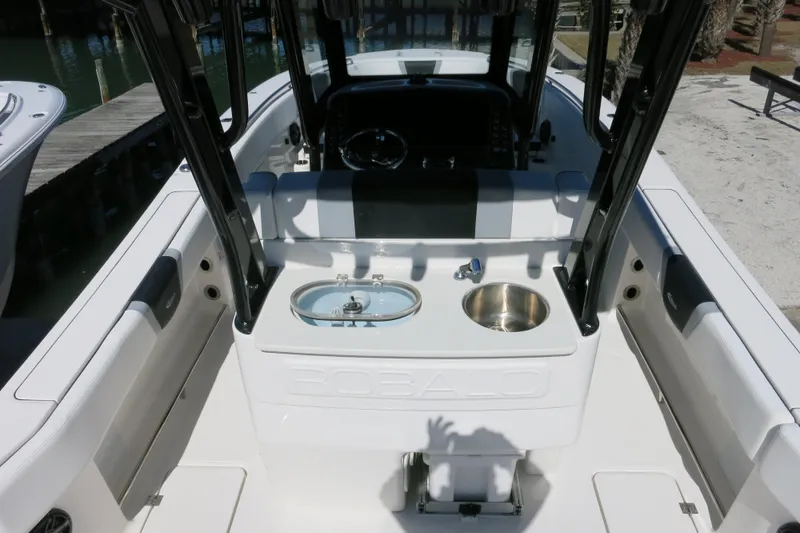 Slide: The Image of 2026 Robalo R270 Center Console boat interior with sink and storage features. - 9