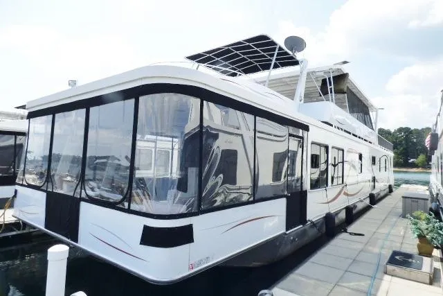 The Image of 2013 Sumerset 18x85 houseboat docked, featuring spacious design and modern amenities. - 0