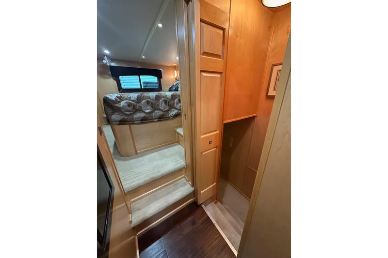 Slide: The Image of Interior of 2013 Sumerset 18x85 houseboat with cozy bedroom and wooden finishes. - 11