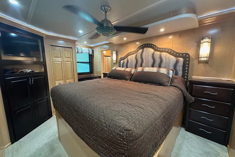 Slide: The Image of Luxurious bedroom interior of 2013 Sumerset 18x85 houseboat with elegant furnishings and ambient lighting. - 15