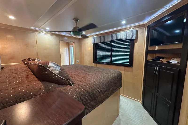 Slide: The Image of Luxurious bedroom interior in a 2013 Sumerset 18x85 houseboat with modern furnishings. - 16