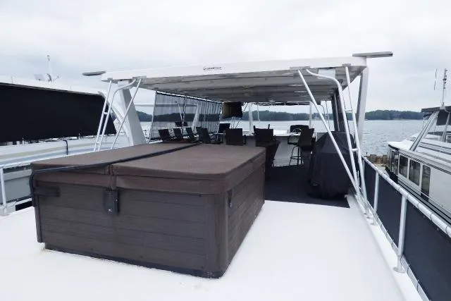 Slide: The Image of 2013 Sumerset 18x85 houseboat with rooftop hot tub and covered seating area. - 19