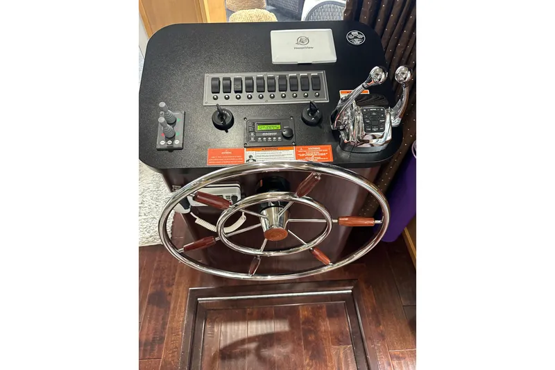 Slide: The Image of Helm of 2013 Sumerset 18x85 houseboat with steering wheel and control panel. - 5