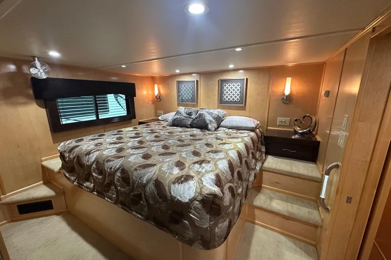 Slide: The Image of Luxurious bedroom interior of 2013 Sumerset 18x85 houseboat with elegant bedding and decor. - 9