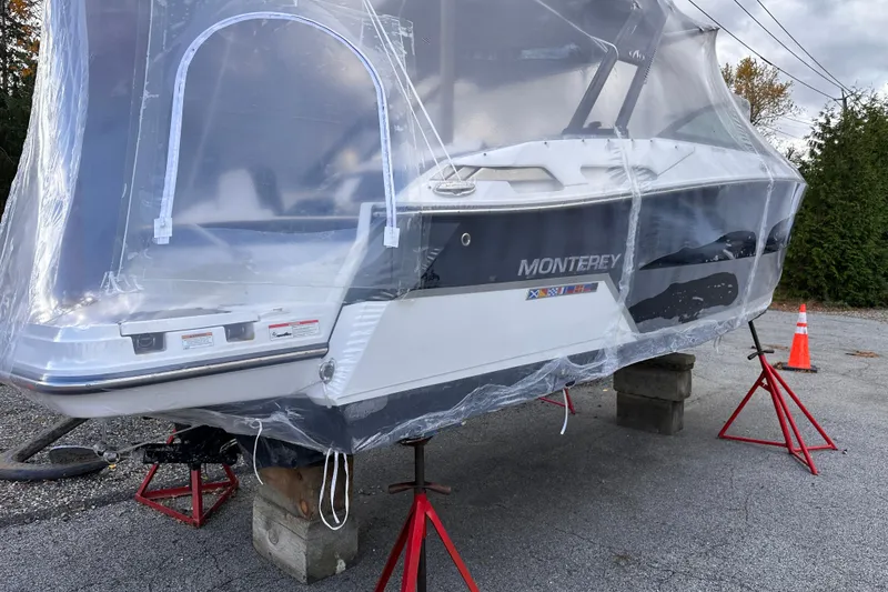 Slide: The Image of 2018 Monterey 258SS Super Sport boat covered in protective wrap, elevated on stands. - 5