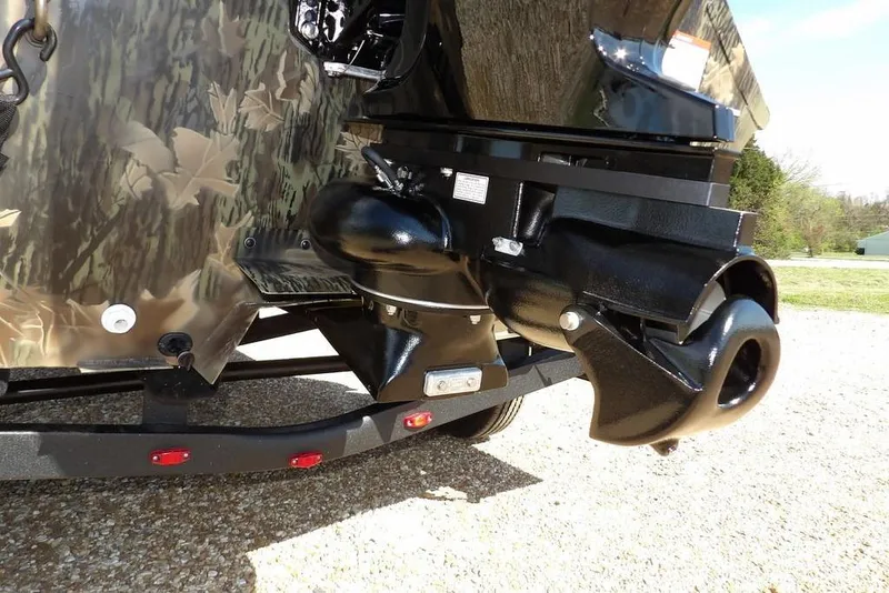 Slide: The Image of 2026 Crestliner 1760 Retriever FCC boat with camo design and powerful outboard motor. - 22