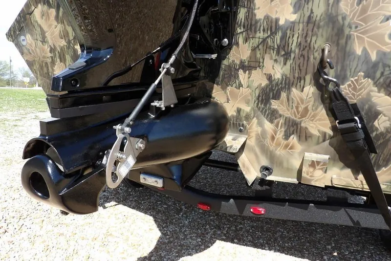 Slide: The Image of Crestliner 1760 Retriever FCC 2026 boat with camouflage design and motor detail. - 29