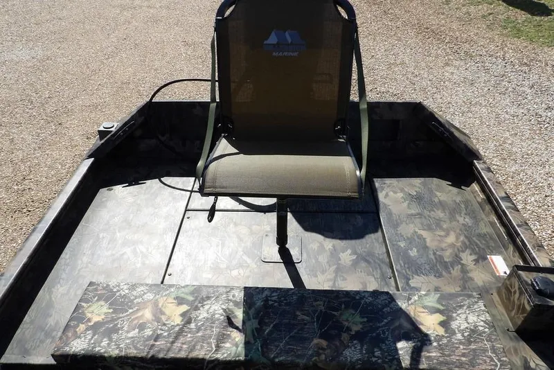 Slide: The Image of 2026 Crestliner 1760 Retriever FCC boat with camouflage seating and flooring. - 8