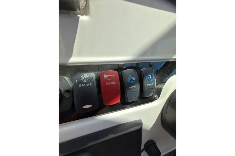 Slide: The Image of 2018 Sailfish 245 DC boat interior with clear view of the water through windshield. - 17