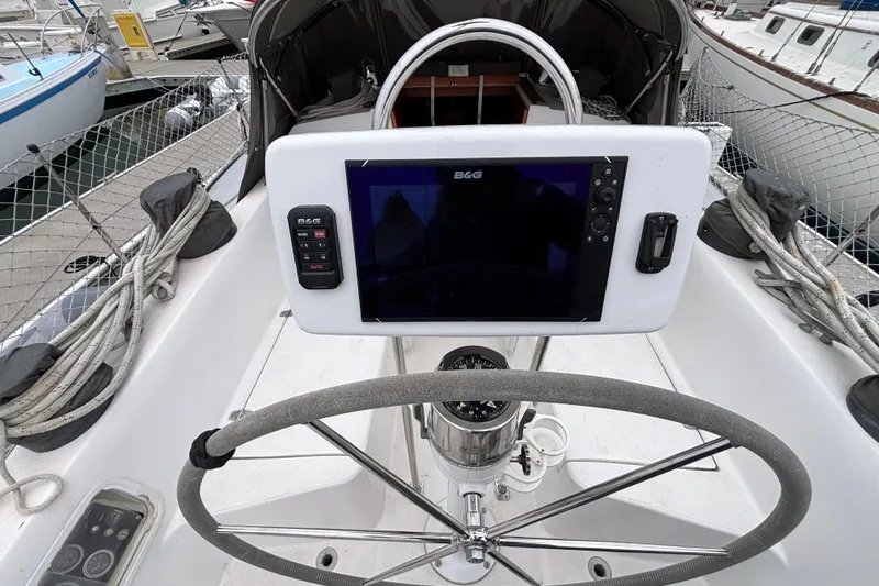 Slide: The Image of Cockpit of 1979 Islander Peterson 40 sailboat with navigation equipment and steering wheel. - 10