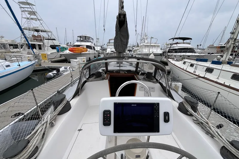 Slide: The Image of Cockpit view of 1979 Islander Peterson 40 sailboat docked in a marina. - 12