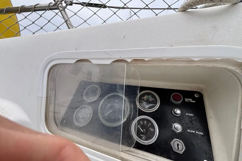 Slide: The Image of Control panel of a 1979 Islander Peterson 40 sailboat with gauges and buttons. - 16