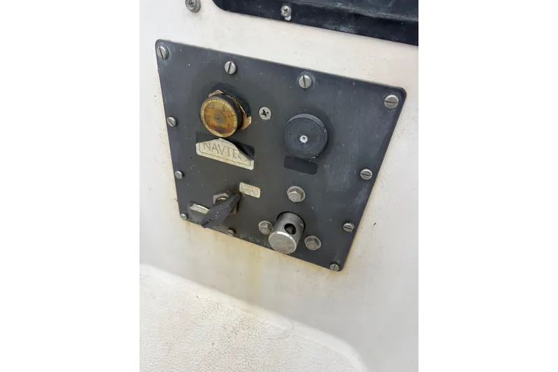 Slide: The Image of Control panel on 1979 Islander Peterson 40 sailboat, featuring various switches and dials. - 18