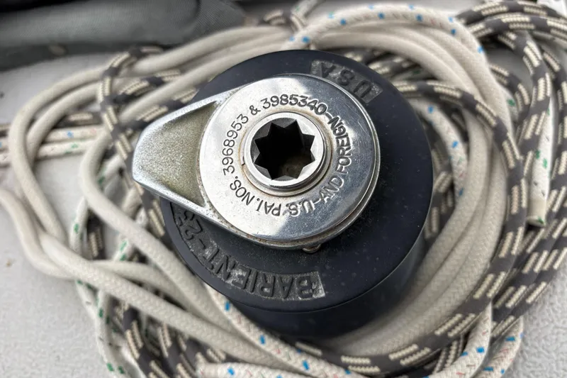 Slide: The Image of Winch mechanism on 1979 Islander Peterson 40 sailboat with coiled ropes. - 24