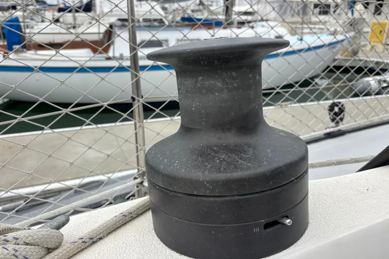 Slide: The Image of Winch on 1979 Islander Peterson 40 sailboat, docked with other boats in background. - 25