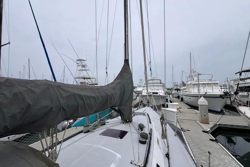Slide: The Image of 1979 Islander Peterson 40 sailboat docked among other boats in a marina. - 31