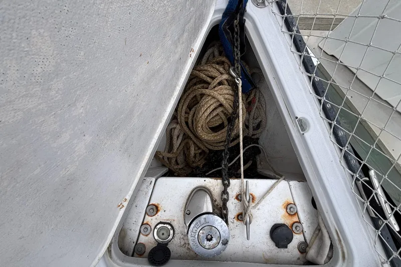 Slide: The Image of Anchor locker of 1979 Islander Peterson 40 sailboat with ropes and lock. - 33