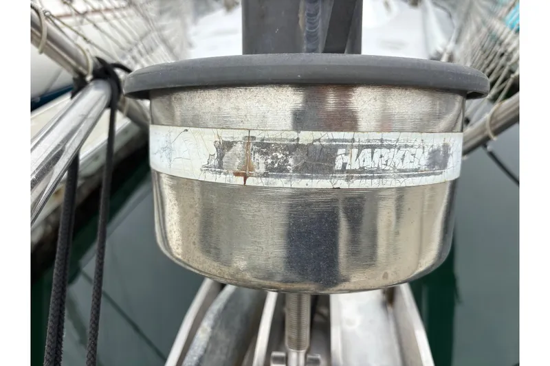 Slide: The Image of Close-up of a weathered Harken winch on a 1979 Islander Peterson 40 sailboat. - 34
