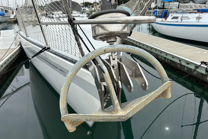 Slide: The Image of 1979 Islander Peterson 40 sailboat with anchor, docked in marina. - 35