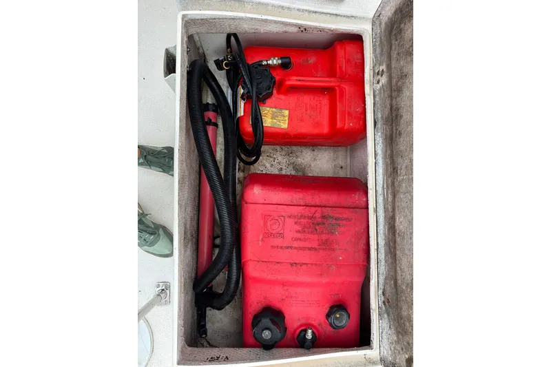 Slide: The Image of Red fuel containers in storage compartment of 1979 Islander Peterson 40 sailboat. - 36