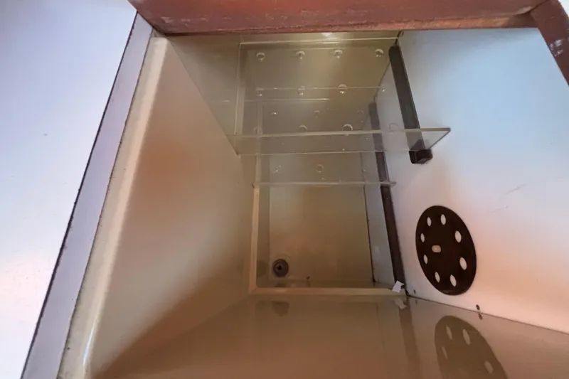 Slide: The Image of Interior compartment of a 1979 Islander Peterson 40 sailboat, featuring storage space. - 47