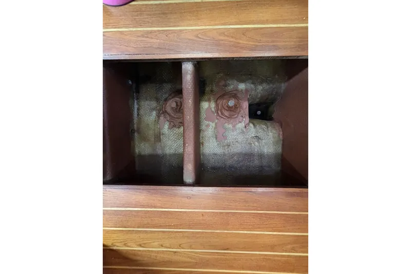 Slide: The Image of Interior view of 1979 Islander Peterson 40 sailboat, showcasing wooden flooring and structural components. - 63