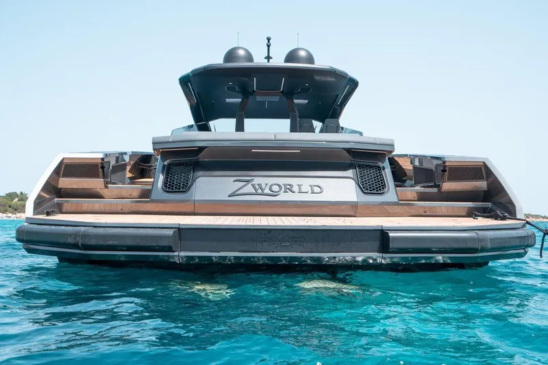 Slide: The Image of Luxury Maori Family yacht 2022 on clear blue water, rear view. - 3