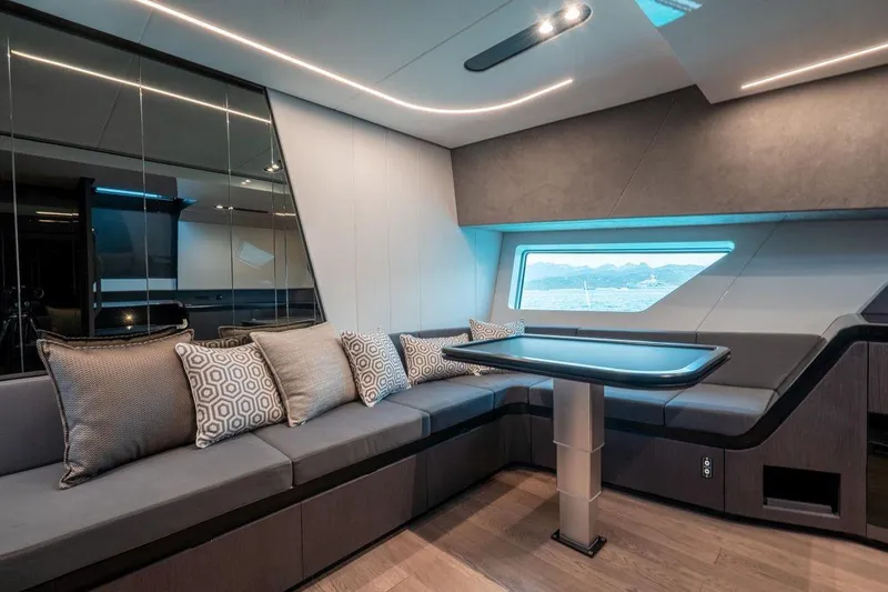 Slide: The Image of Luxurious interior of 2022 Maori Family yacht with modern seating and scenic window view. - 5