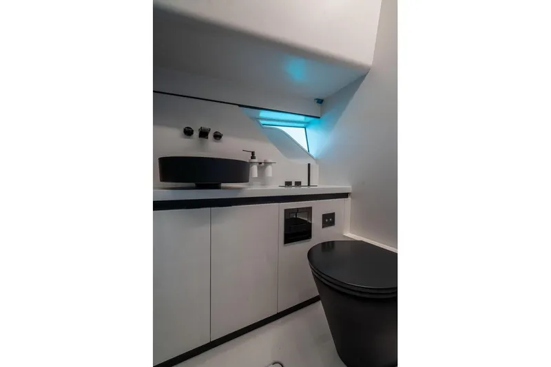 Slide: The Image of Modern bathroom interior in 2022 Maori Family model, featuring sleek black and white design. - 6