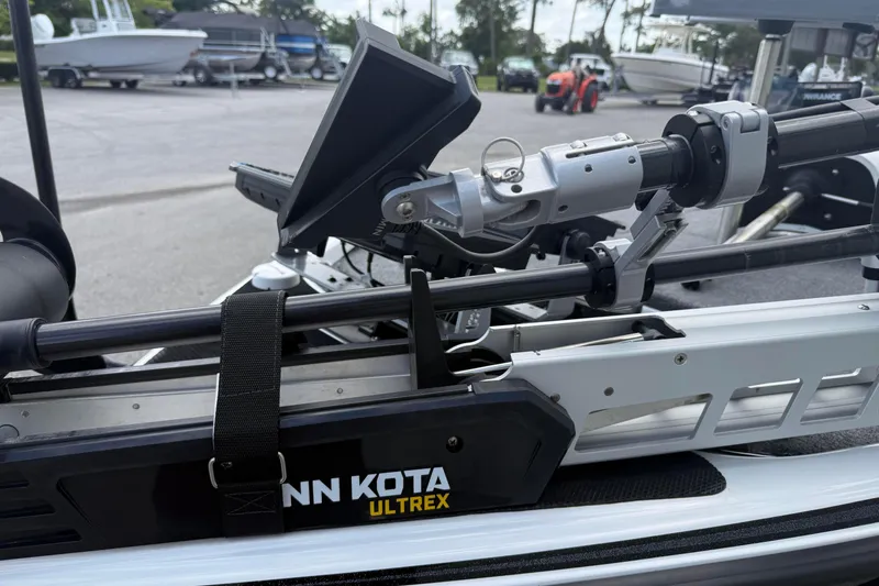 Slide: The Image of 2023 Phoenix 921 Elite II with Minn Kota Ultrex trolling motor in a boatyard. - 12