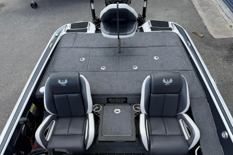 Slide: The Image of 2023 Phoenix 921 Elite II boat interior with dual seats and spacious deck. - 16