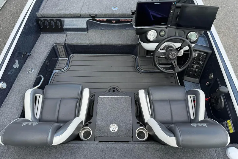Slide: The Image of 2023 Phoenix 921 Elite II boat cockpit with dual seats, steering wheel, and navigation screens. - 20