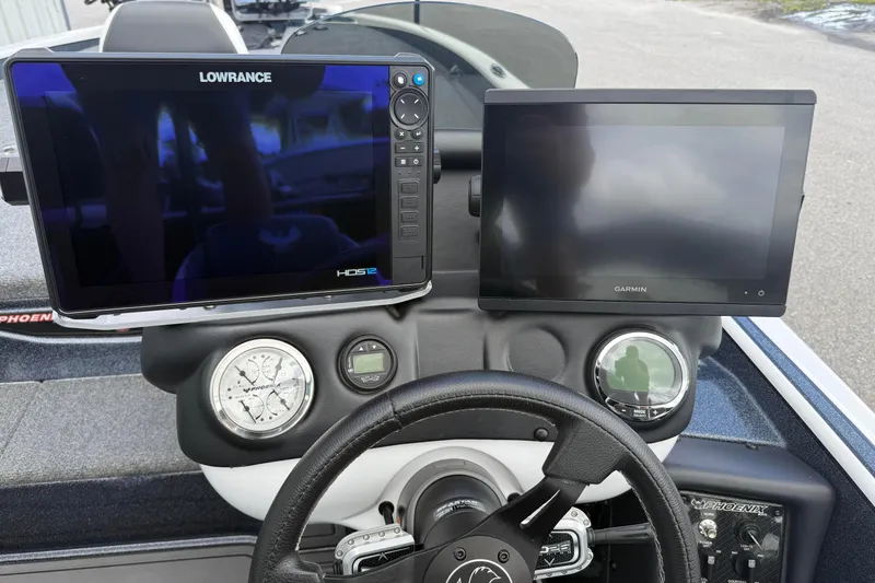 Slide: The Image of Dashboard of 2023 Phoenix 921 Elite II with Lowrance and Garmin displays. - 21