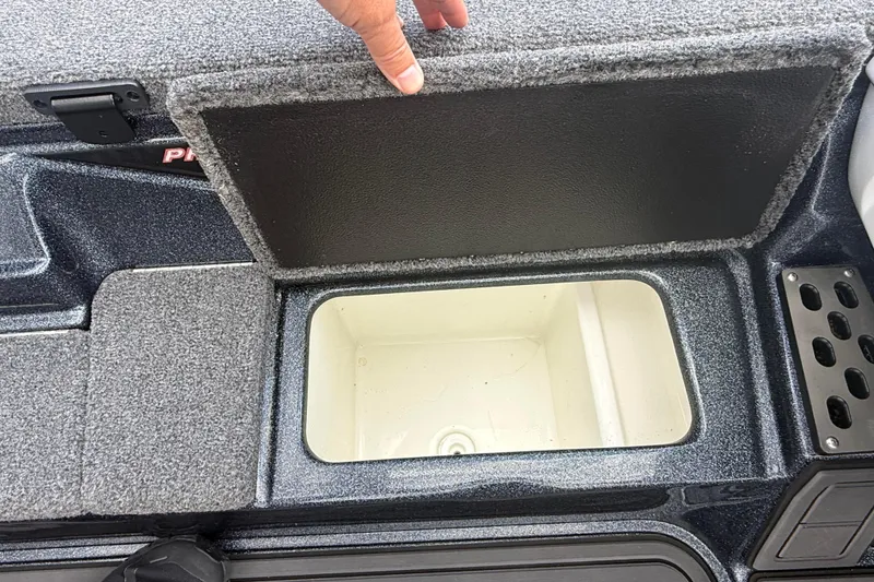 Slide: The Image of Open storage compartment in 2023 Phoenix 921 Elite II boat. - 24