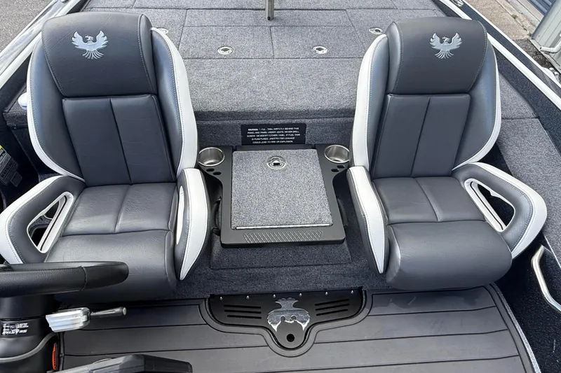 Slide: The Image of 2023 Phoenix 921 Elite II boat interior with two gray seats and center console. - 29