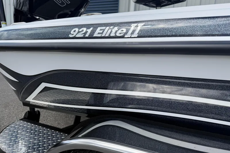 Slide: The Image of 2023 Phoenix 921 Elite II boat with sleek design and metallic accents. - 3