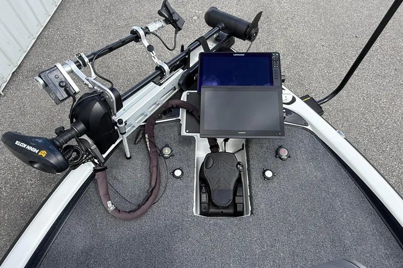 Slide: The Image of 2023 Phoenix 921 Elite II boat dashboard with dual screens and trolling motor. - 31